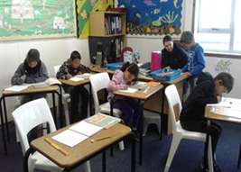 Students sitting at desks in school